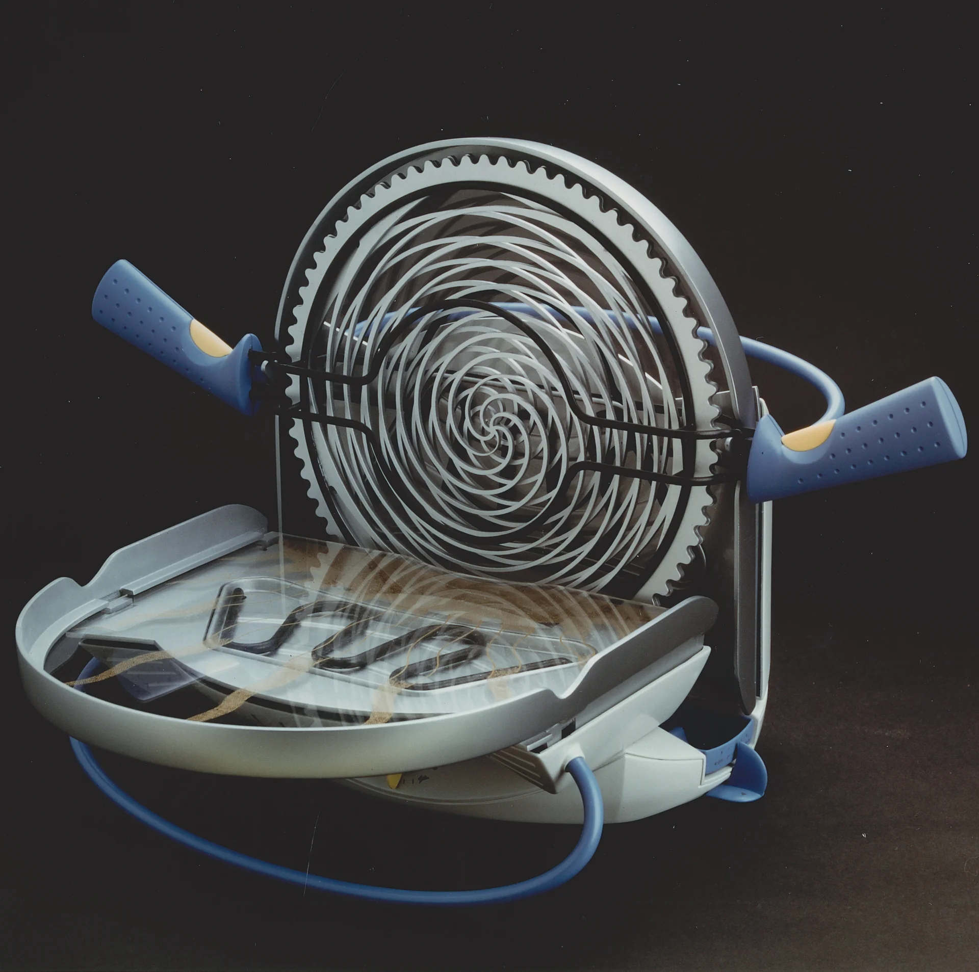 Meat cage exposed, with teeth visible around its rim.